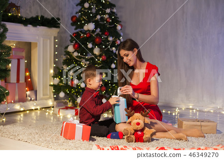 mother and son celebrate the new year Christmas tree gifts mother and son celebrate the new year Christmas tree gifts 46349270
