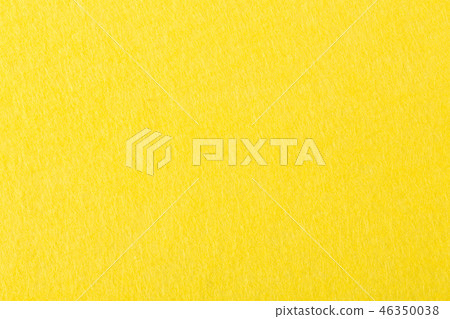 Background of bright yellow felt on macro. 46350038
