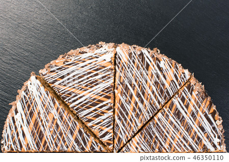 Half of delicious cake isolated on a black background. Half of delicious cake isolated on a black background. 46350110