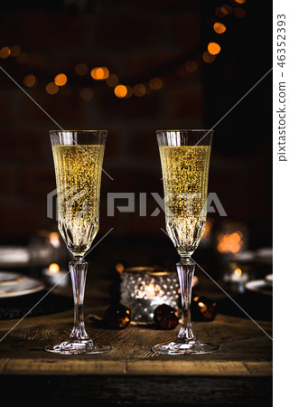Christmas or New year festive set with glasses of champagne Christmas or New year festive set with glasses of champagne 46352393