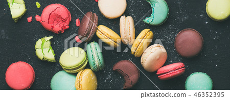 Flat-lay of sweet colorful French macaroon cookies variety, wide composition Flat-lay of sweet colorful French macaroon cookies variety, wide composition 46352395