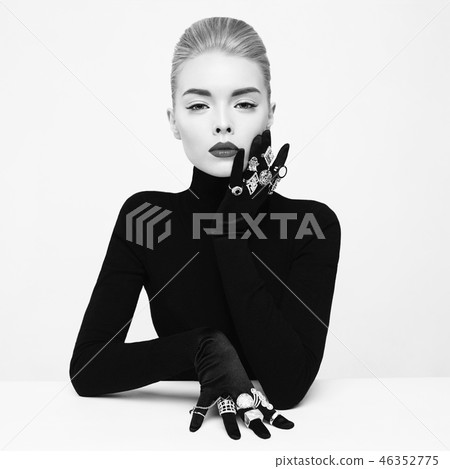 Beautiful blonde lady with lot of precious rings 46352775