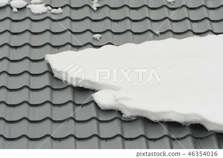 Metal tiling roof in winter season covered snow Metal tiling roof in winter season covered snow 46354016