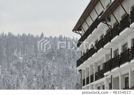 The hotel building against the snow-covered The hotel building against the snow-covered 46354017