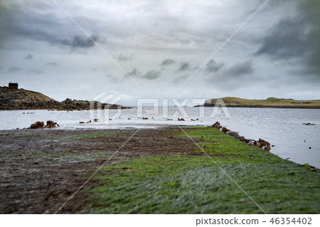 The jetty at Camus Mor at the coastline of north west Skye by Kilmuir - Scotland, United Kingdom 46354402