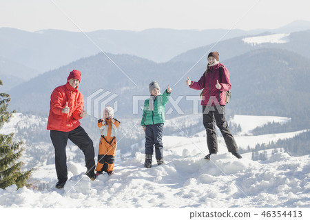 Mother, father and two sons are standing 46354413