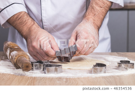 male cook preparing Christmas cookies 46354536