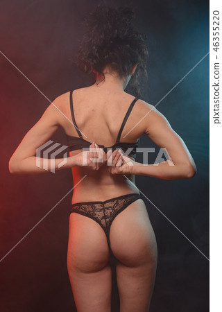young girl in underwear stands with her back 46355220