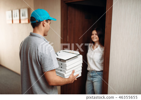 Female customer on doorstep and pizza delivery boy 46355655