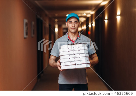 Delivery man with fresh pizza in carton boxes Delivery man with fresh pizza in carton boxes 46355669