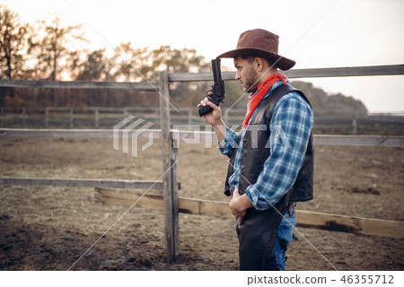 Cowboy with revolver, gunfight in gesert valley Cowboy with revolver, gunfight in gesert valley 46355712