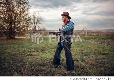 Brutal cowboy with revolver, gunfight on ranch 46355717