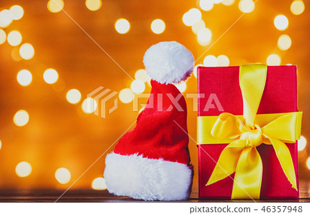Christmas gift box and Santa Claus hat Christmas gift box and Santa Claus hat 46357948