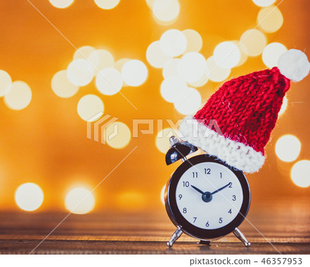 Vintage alarm clock with Santa Claus hat Vintage alarm clock with Santa Claus hat 46357953