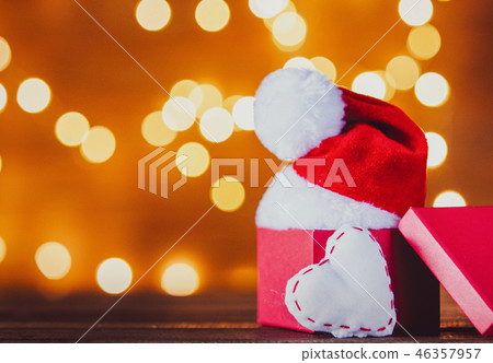 Christmas gift box and Santa Claus hat with heart shape Christmas gift box and Santa Claus hat with heart shape 46357957