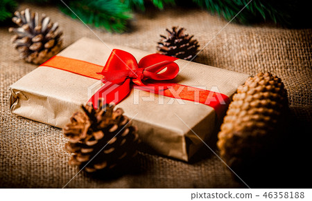 Christmas gift and pine cones 46358188