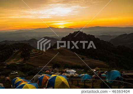 tent in the sunset overlooking mountains 46363404