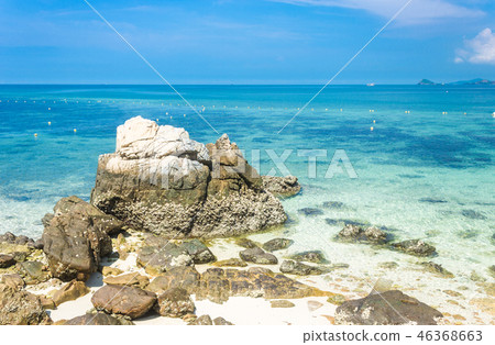 Tropical island rock on the beach with blue sky 46368663