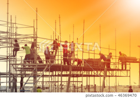 Blurred photo of construction workers working 46369470