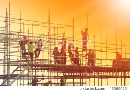 Blurred photo of construction workers working Blurred photo of construction workers working 46369613