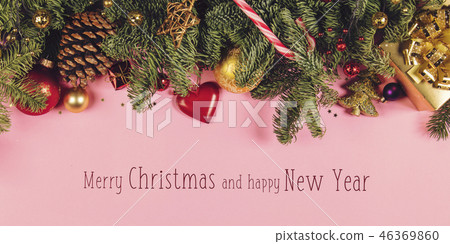Christmas border with fir branches, conifer cones, christmas balls and golden christmas ornaments Christmas border with fir branches, conifer cones, christmas balls and golden christmas ornaments 46369860