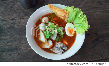 Spicy noodle meat soup serve in white bowl Spicy noodle meat soup serve in white bowl 46370044