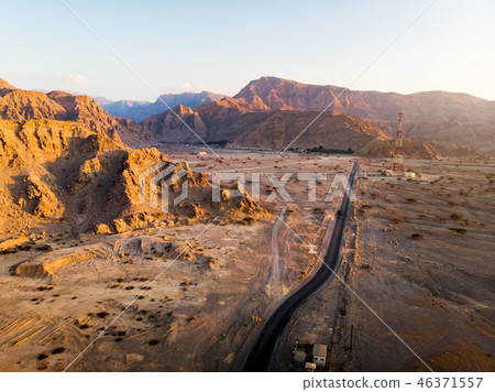 Desert road at sunset aerial view 46371557