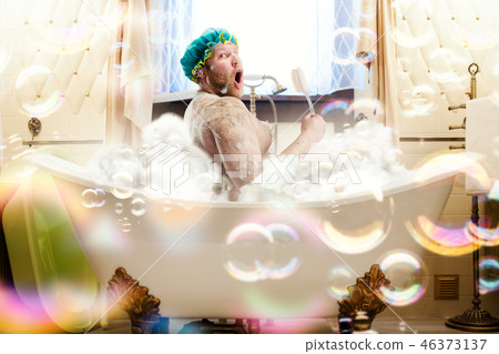 Fat ugly man washing in a bath Fat ugly man washing in a bath 46373137