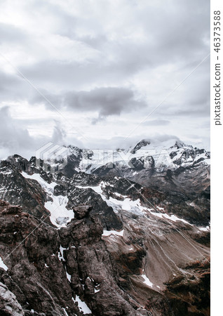 Snow cliff behind cloud and Mount Titlis Engelberg 46373588