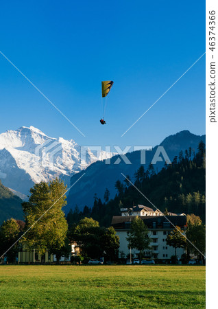 Paragliding over Hohematte park and Swiss alps Paragliding over Hohematte park and Swiss alps 46374366