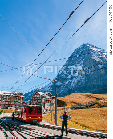Jungfrau train at Kleine Scheidegg with Eiger Peak 46374400