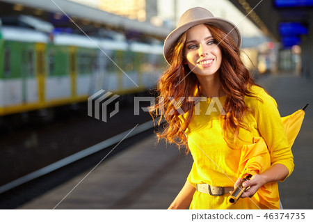 caucasian woman waiting at the railway station caucasian woman waiting at the railway station 46374735