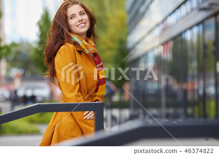 beautiful young woman in autumn city 46374822