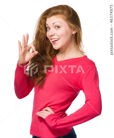Woman is showing OK sign 46374975