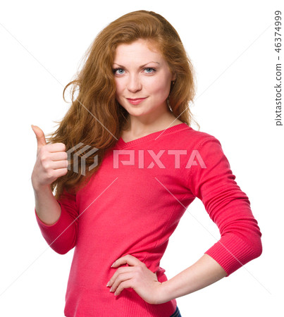 Woman is showing thumb up gesture 46374999