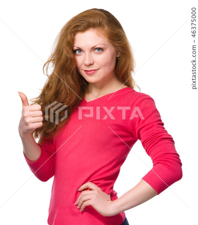 Woman is showing thumb up gesture 46375000