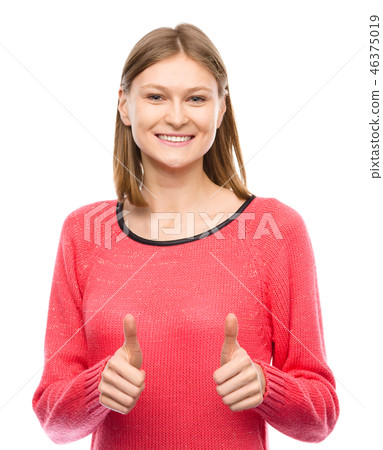 Woman is showing thumb up gesture 46375019