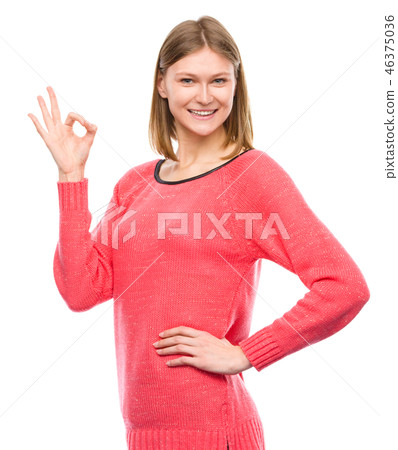 Woman is showing OK sign 46375036