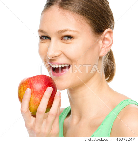 Young happy girl with apple Young happy girl with apple 46375247