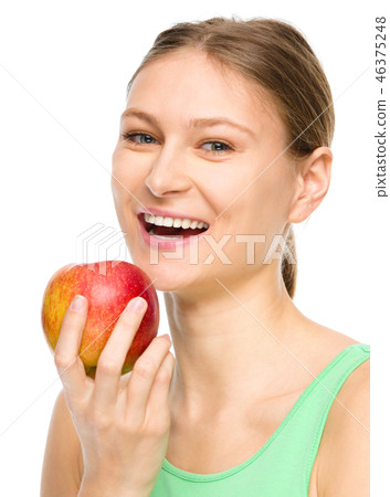 Young happy girl with apple Young happy girl with apple 46375248