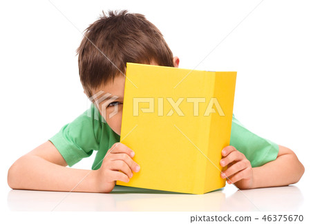 Little boy plays with book Little boy plays with book 46375670