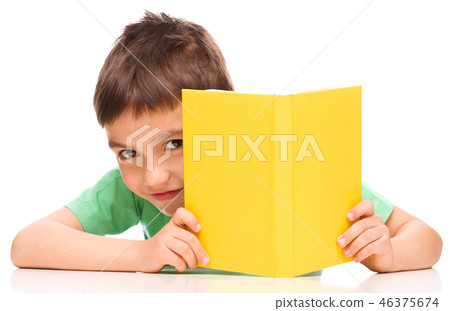 Little boy plays with book Little boy plays with book 46375674