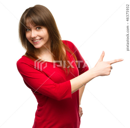 Portrait of a young woman pointing to the right 46375932
