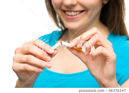 Young woman is breaking a cigarette 46376147