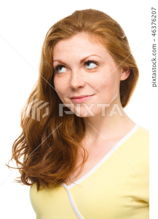 Young happy woman is looking up and smile Young happy woman is looking up and smile 46376207