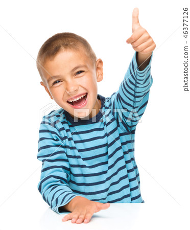 Little boy is showing thumb up sign Little boy is showing thumb up sign 46377126