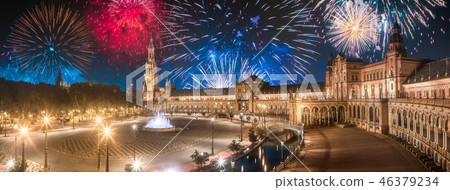 Beautiful fireworks above Spain Square on sunset, Seville Beautiful fireworks above Spain Square on sunset, Seville 46379234