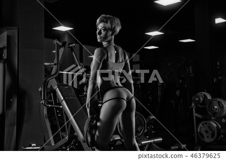 Sexy athletic girl workout in gym. Sexy athletic girl workout in gym. 46379625