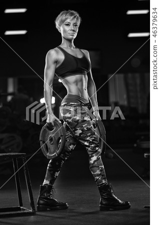 Sexy athletic girl workout in gym. Sexy athletic girl workout in gym. 46379634