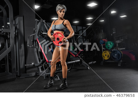 Sexy athletic girl workout in gym. Sexy athletic girl workout in gym. 46379658